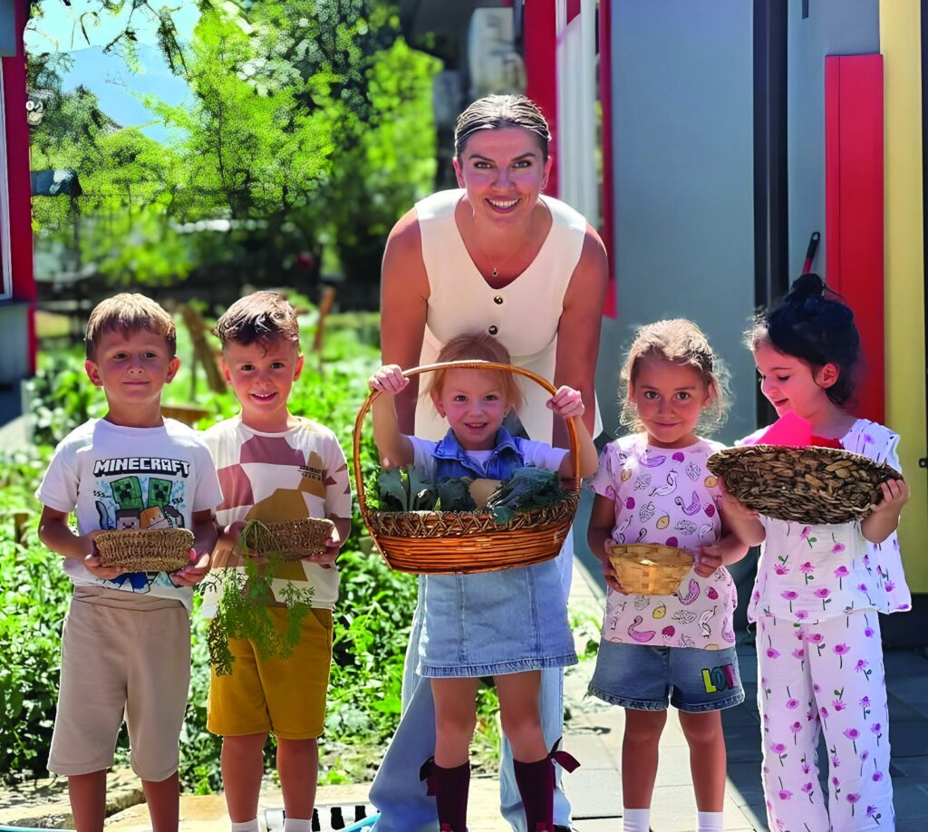 Kindergarten children with the donated seedlings